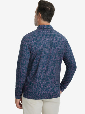 Back upper body view of the lightweight print polo in navy pink seagull, model turns slightly with relaxed pose.