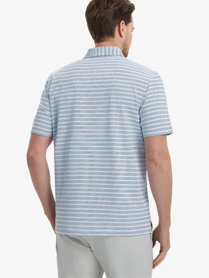 Back view of model in Navy Blue Stripe Performance Stripe Golf Shirt