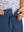 Detail: waistband of dark blue boys lightweight dry fit flat front golf shorts