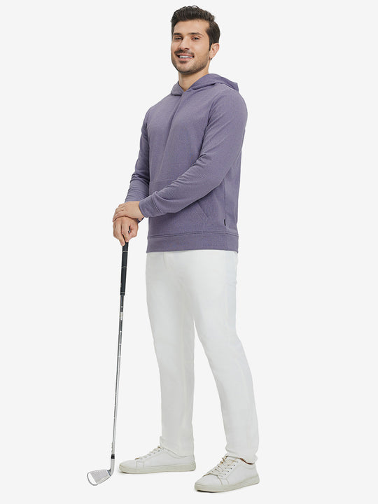 Model full-body view holding a golf club wearing warm fleece golf hoodies pullover in purple.