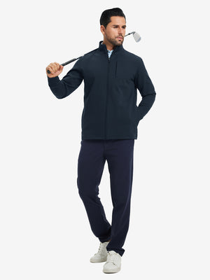 Model holding a golf club, wearing navy water-resistant zip up golf jacket in full-body view.