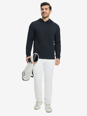 Full body view of model holding golf club in texture solid hoodies pullover, sporty look, navy.