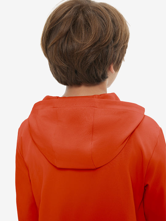 Back upper view of youth long sleeve hoodied with kangaroo pocket in orange, showing fit and shoulders.