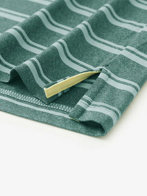 Hem slit detail of DARK GREEN STRIPE Performance Yarn Dye Striped Polo highlighting stitching and finish