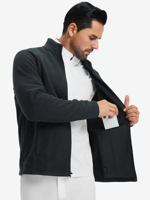 Model showing inner pocket of soft winter fleece jackets in black, fitting an iPhone inside.