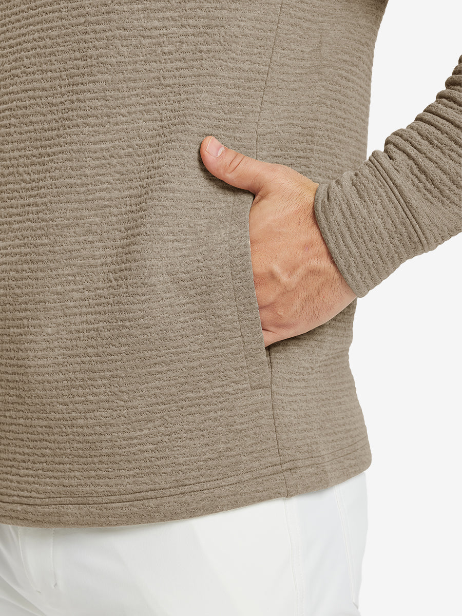 Close-up of pocket detail, single hand inside texture solid hoodies pullover, casual style in light brown heather.