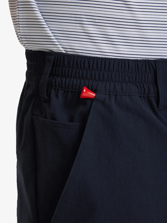 Side pocket close-up with golf tee holder on Performance Water Resistant Pants in NAVY