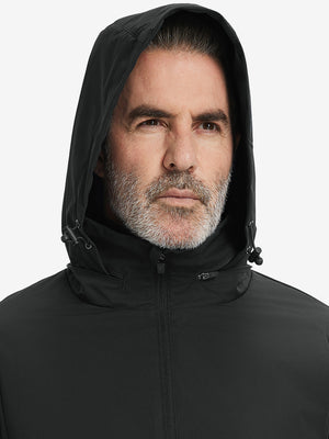 Close-up of hood on the lightweight water-repellent softshell hooded jacket, worn by model in black.