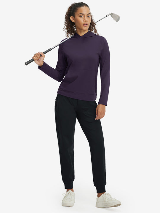 Model holding golf club, dressed in women's lightweight hoodies pullover in dark purple.