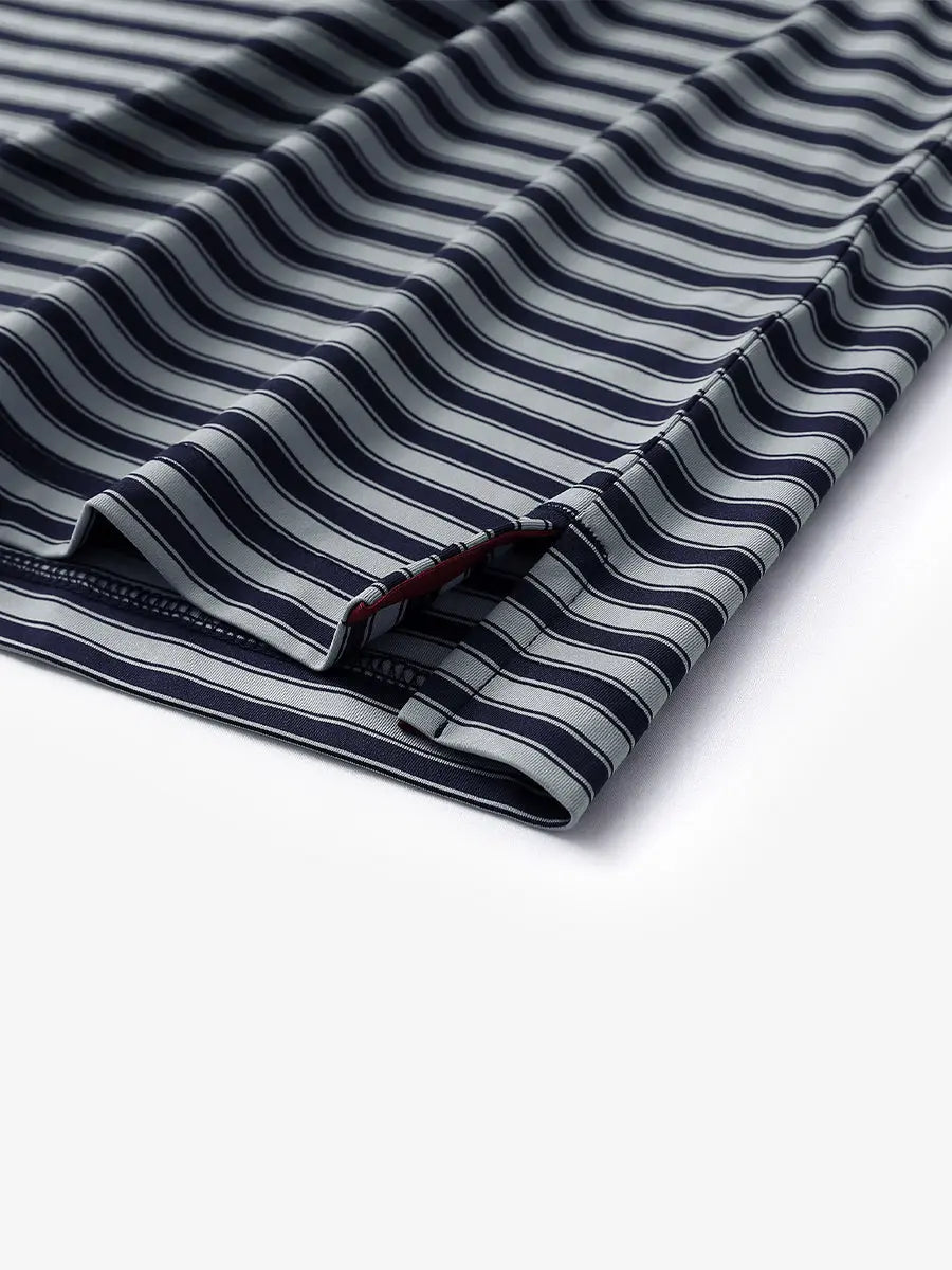Detailed shot of the hem slit on the Navy Grey Yarn Dyed Stripe Polo – subtle craftsmanship