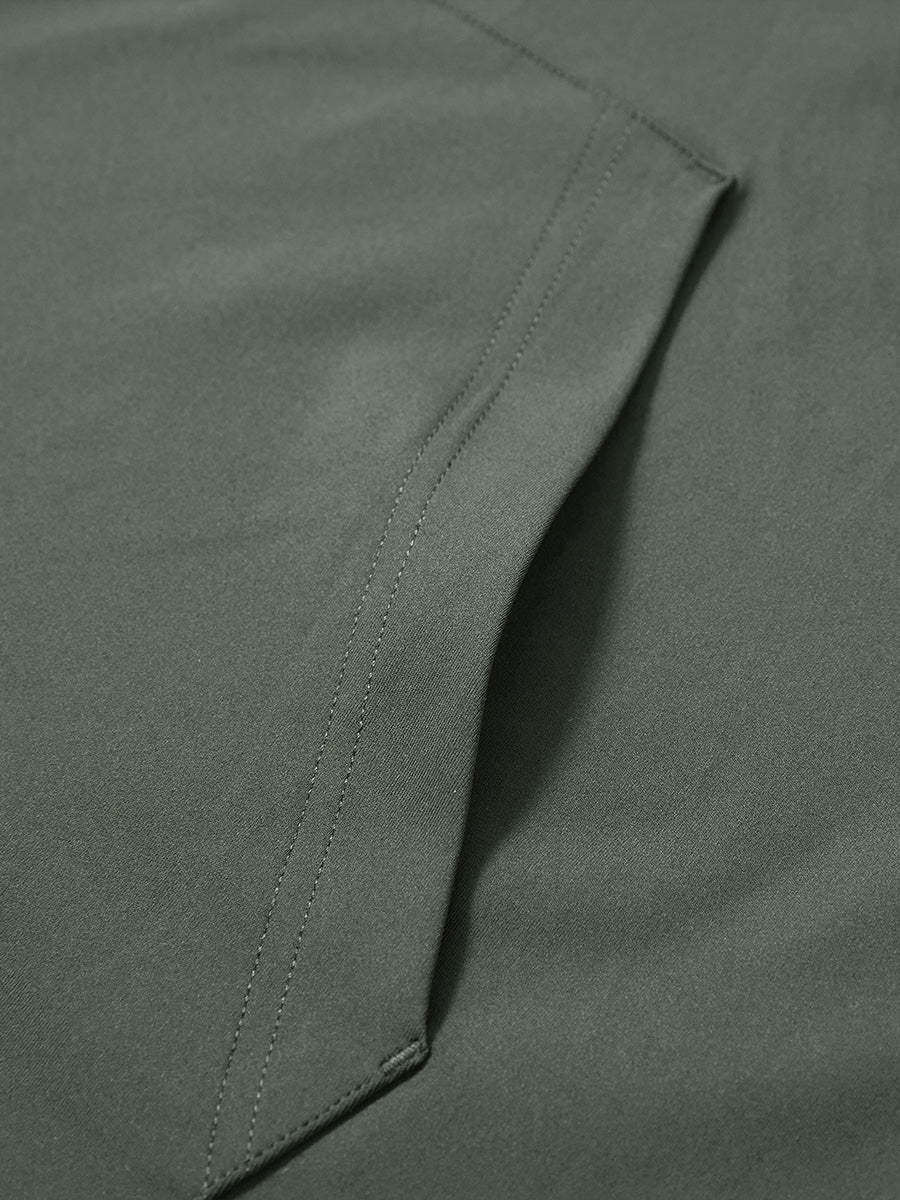 Close-up of single pocket detail on youth long sleeve hoodied with kangaroo pocket in olive green, showing stitching.