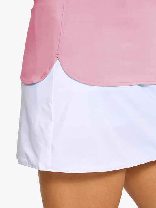 Detail shot of side hem opening on PINK Women's Performance Solid Polo