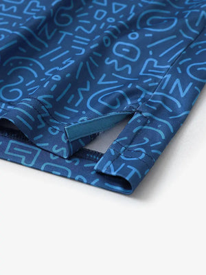 Detailed close-up of side hem slit on BLUE GRAFFITI Performance Print Boys Golf Polo for breathability