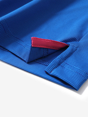 Hem detail of Long sleeve pinstripe jersey polo with neat finish in cobalt stripe