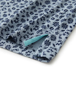 Hem slit detail of GRAYISH BLUE FLOWER Popular Heather Print Polo highlighting stitching and finish