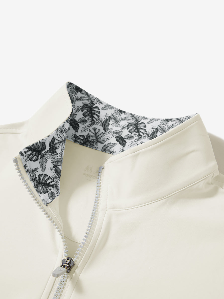 Zipper and inner pattern detail of the print collar quarter zip golf vest in cream, highlighting design.