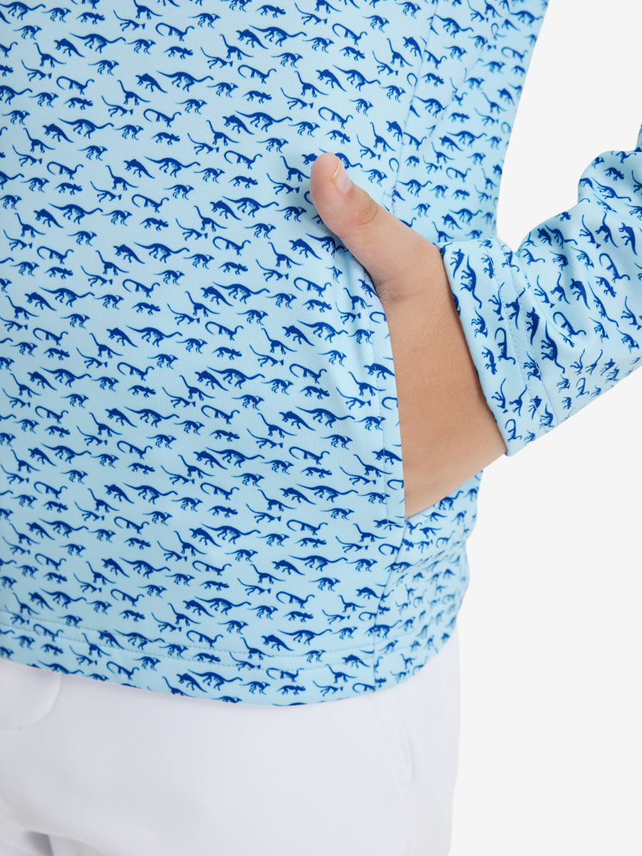 Model with both hands in pockets wearing youth full print stylish hoodies pullover in blue dinosaur.