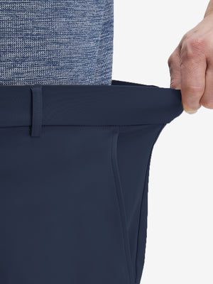 Detail view of elastic waistband on navy flat front golf joggers pants with belt loops