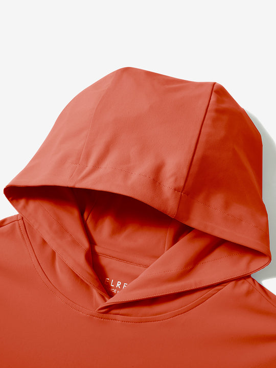 Hood detail of the orange dry fit stretchy sweatshirts hoodie, showing smooth fabric and neat seams.