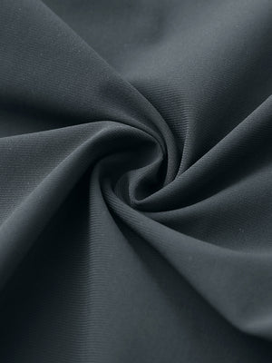 Close-up of quick dry casual dress pants fabric in dark grey, smooth texture with breathable finish
