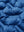 Fabric close-up of boys windproof puffer jacket with pockets, highlighting texture and finish in klein blue.