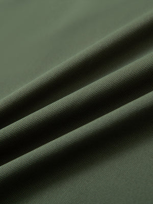 Fabric detail of Long sleeve performance solid pique polo with breathable knit in olive green