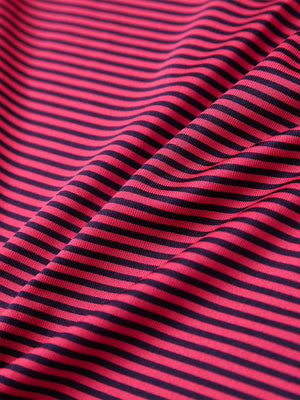 Fabric detail of Performance cooling polo - youth with breathable feel in red stripe