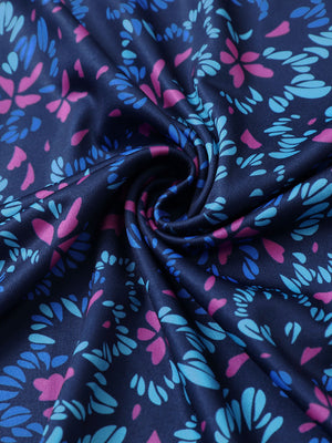 Texture detail of Performance jersey print polo with soft stretch in navy colorful flower