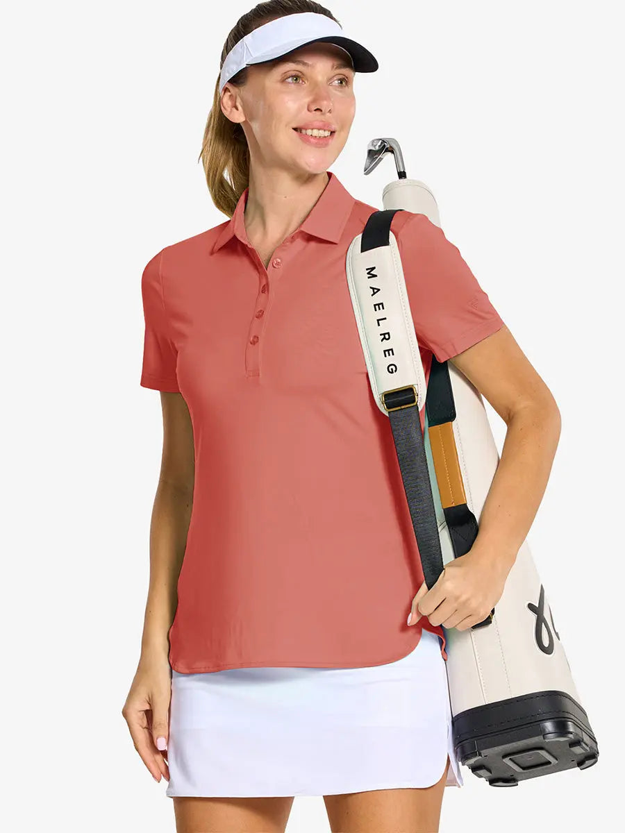 Front half-body of model in CORAL PINK Women's Performance Solid Polo with golf bag