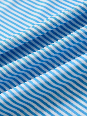 Close-up of sky blue stripe performance cooling polo - youth fabric texture.