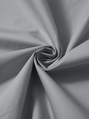 Detail of the lightweight water-repellent softshell hooded jacket in neutral grey, fabric twisted into a spiral roll.