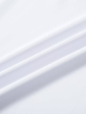 Close-up of white ventilated pique performance polo fabric showing breathable texture.