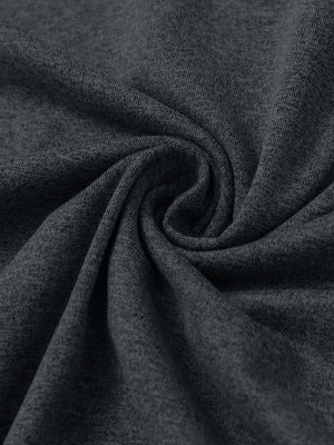 Fabric close-up of quarter zip hoodie with kangaroo pocket, soft texture and cozy feel in dark grey heather
