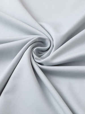 Close-up of glacier grey premium performance polo fabric showing smooth texture.