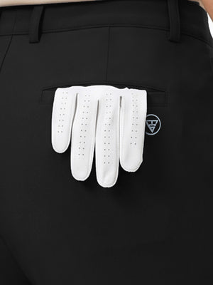 Detail view of back pocket on black women's regular fit stretchy golf pants