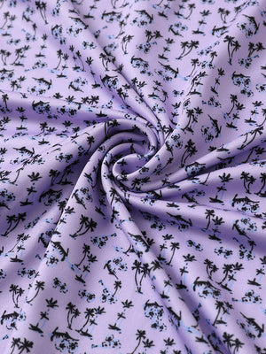 Close-up of lavender seaside palm performance jersey print polo fabric showing breathable texture.