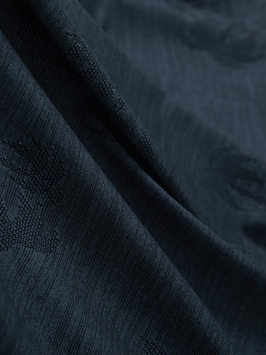 Close-up of navy coconut tree breathable jacquard pattern 3-button golf polo fabric texture