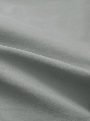 Close-up texture of rose dust flat front flex cotton blend golf shorts fabric showing detailed cotton blend material and weave.