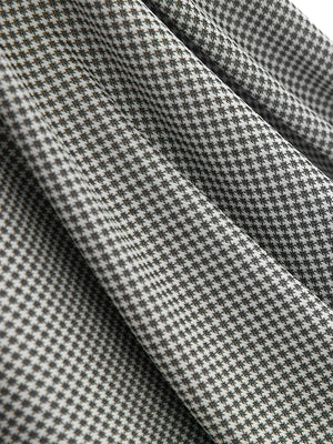 Close-up of the jacquard fabric texture on the black quick dry ribbed collar golf shirt