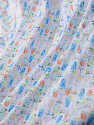 Macro view of the colorful wine glass 4 way stretch print collared polo shirt fabric, showcasing the unique print design