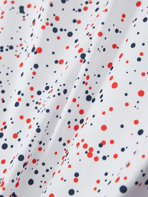 Macro view of the white polka dots 4 way stretch print collared polo shirt fabric, showcasing the unique print design