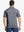 Front half-body shot of model holding golf club wearing Ventilated Heather Jacquard Polo – NAVY HEATHER
