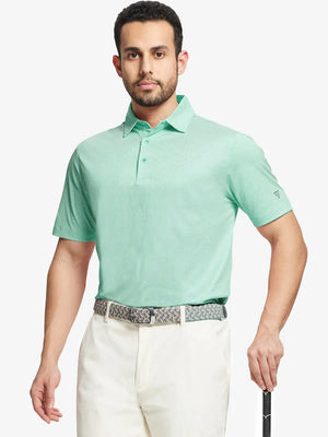 Model front half-body holding golf club wearing ICE GREEN Performance Ananas Jacquard Polo