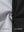 Close-up of fabric on water-resistant heat-tech softshell winter jacket with hood, showing texture in black.