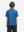 Back half-body view of youth wearing blue graffiti performance print boys golf polo, showing rear design