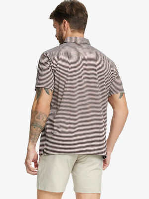 Back half-body shot of model showcasing the back of Sport Fit Stripe Polo in Brown Stripe