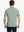 Back half-body shot of model showcasing the back of Sport Fit Stripe Polo in Dark Green Stripe