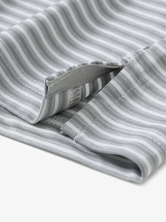 Close-up detail of hem opening on Sport Fit Stripe Polo in Grey White Stripe