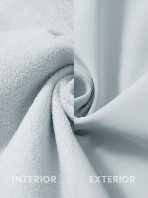 Fabric close-up of reflective hooded softshell jacket, showing texture and finish in light gray.