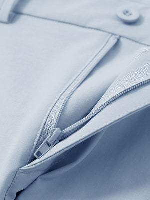 Detail view of the zipper on the sky blue youth water resistant cotton blend golf pants, highlighting secure closure